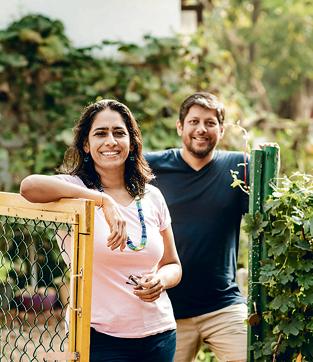 Karan Manral and Yogita Mehra at the gate of their organic kitchen garden in Goa